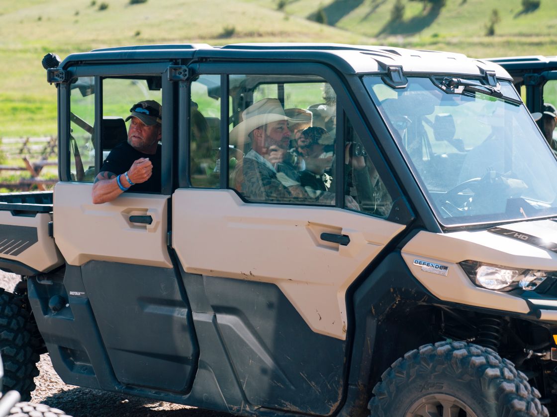 people riding in a UTV