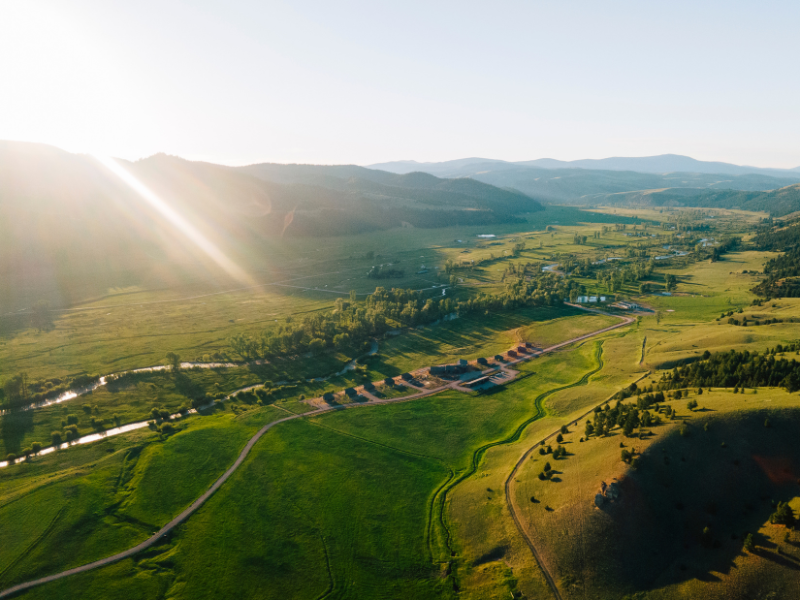 grassy valley with surrounding mountains