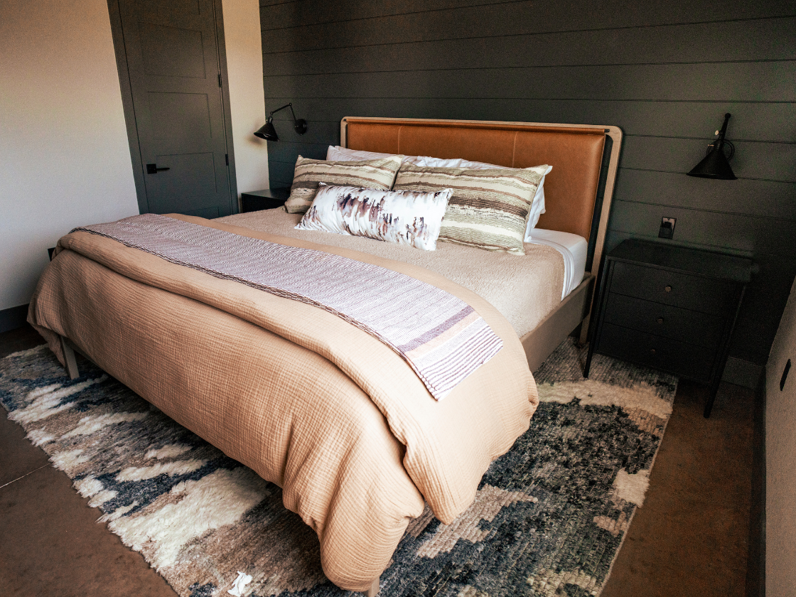 a bed in a dark room