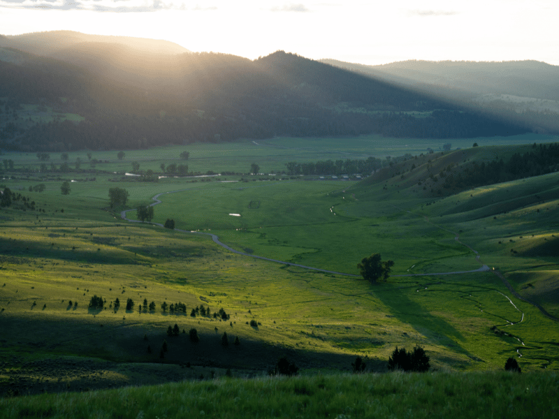 a large river valley in Montana at sunset