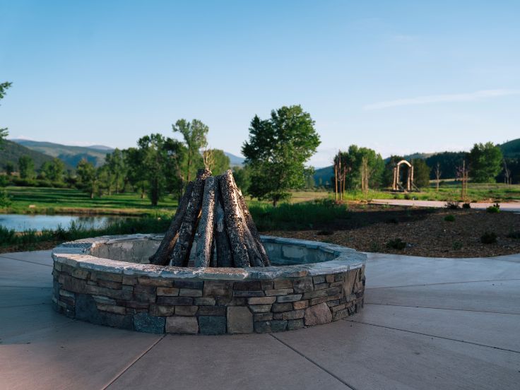 a firepit in a river valley