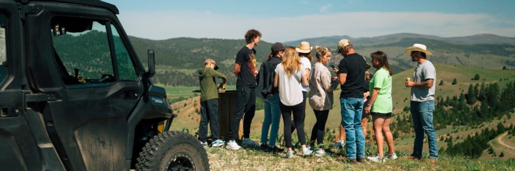 several people standing on a hill