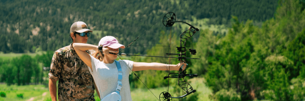 woman learning archery in montana