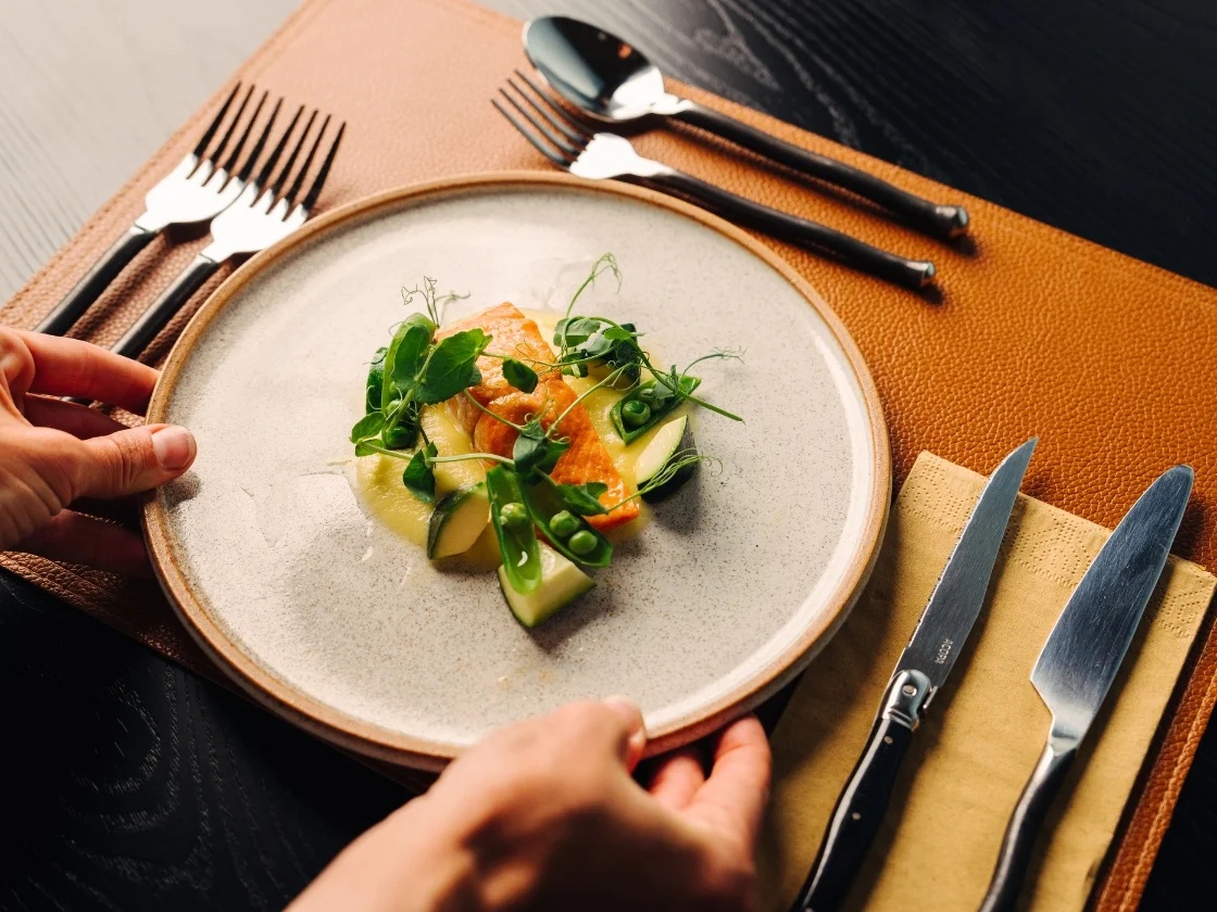 a plate full of food on an orange placemat